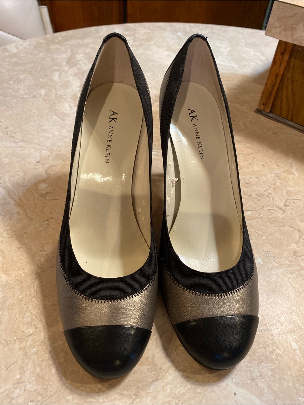 Anne Klein Black and Metallic Taupe Cap-Toe Pumps